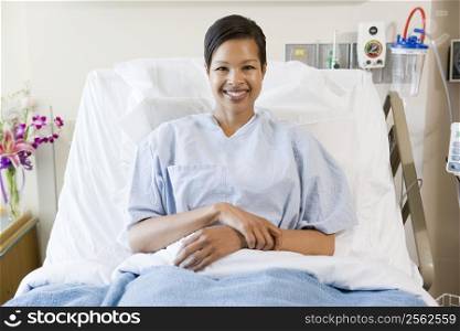 Woman Sitting In Hospital Bed