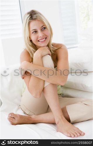 Woman sitting in living room