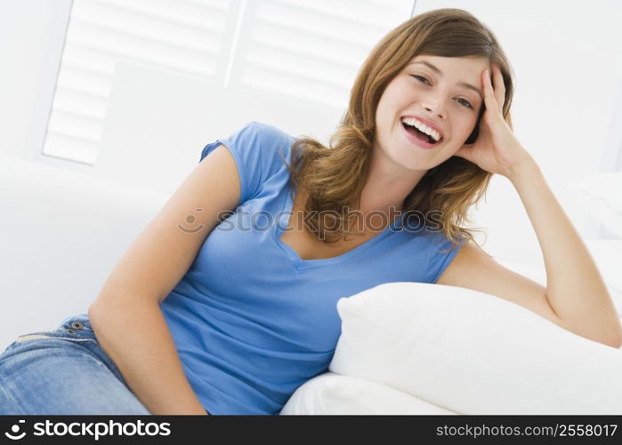 Woman sitting in living room