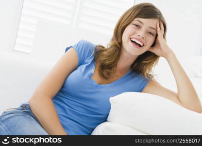 Woman sitting in living room