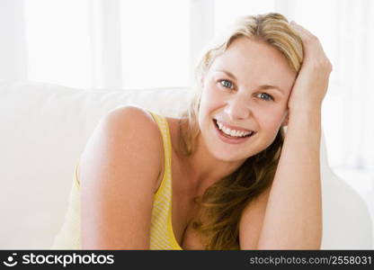 Woman sitting in living room