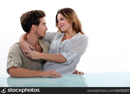 Woman sitting in the lap of her boyfriend