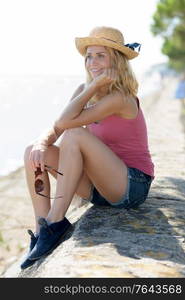 woman sitting mesmerizing on the seawall