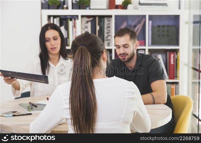woman sitting office talking
