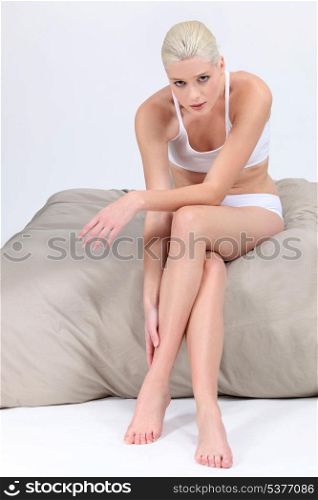 Woman sitting on a bed