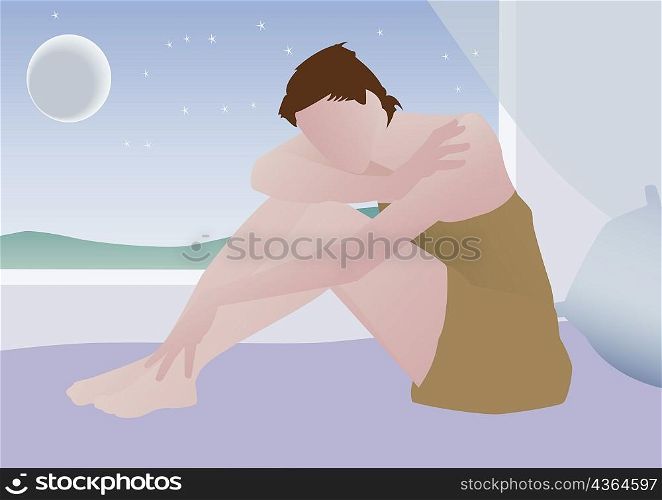 Woman sitting on a bed with her head on her arm