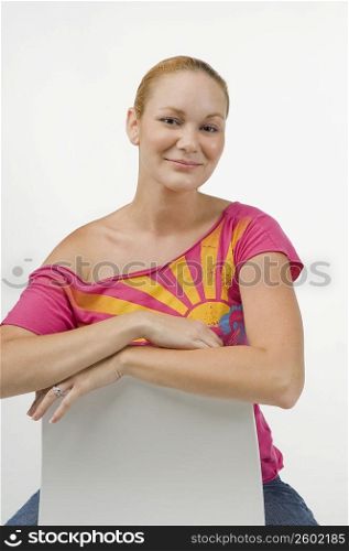 Woman sitting on a chair and smiling
