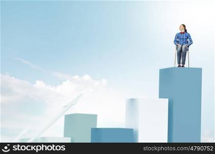 Woman sitting on bars. Young woman sitting on chair on graph bars