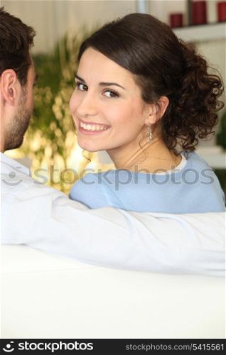 woman sitting on sofa with boyfriend