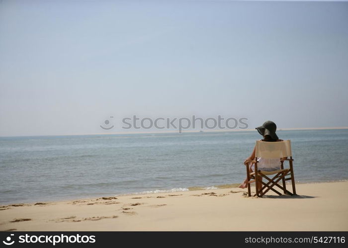 Woman sitting on the beach