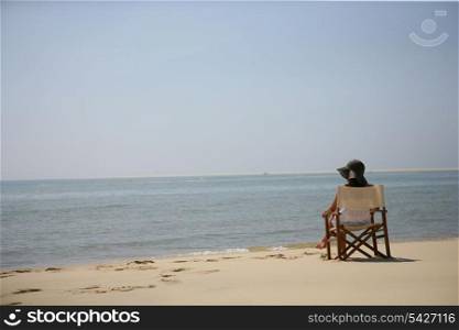 Woman sitting on the beach