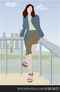 Woman sitting on the edge of a railing