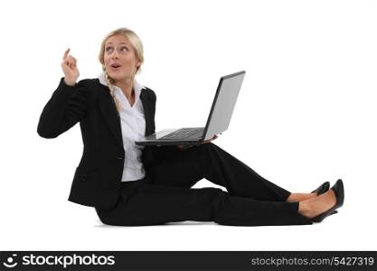 Woman sitting on the floor with computer