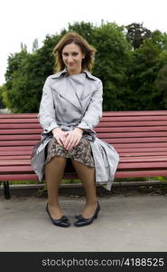 Woman Sitting On The Red Bench