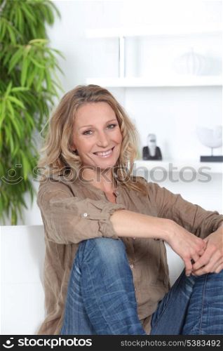 Woman sitting on the sofa