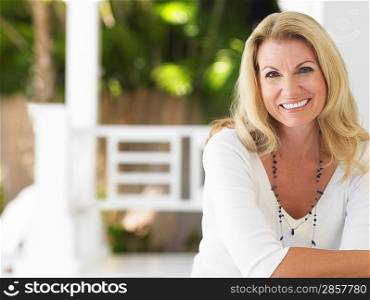 Woman sitting on verandah portrait