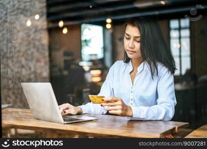 woman sitting thinking about credit card balances,notebook.