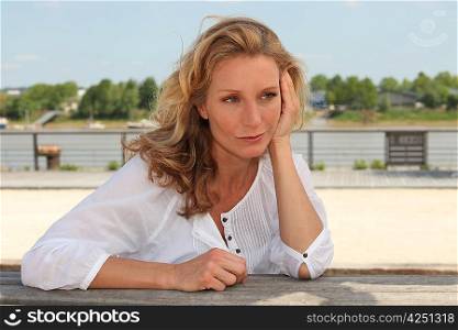 Woman sitting waterfront