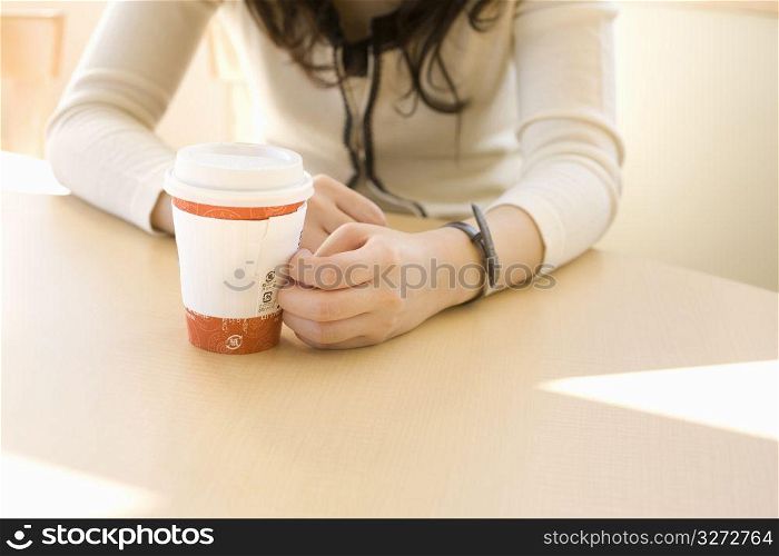 woman sitting with drink