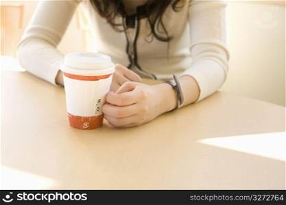 woman sitting with drink