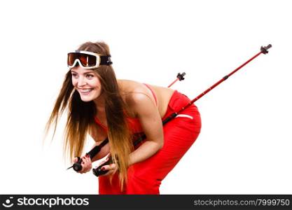 Woman skier in googles with ski poles. Winter sport. Woman sexy hot skier model wearing fit bra ski googles with poles. Winter sport activity. Beautiful seductive sportswoman isolated on white