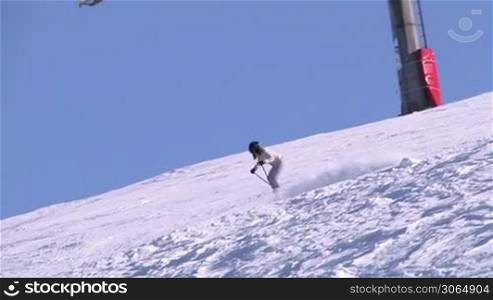 Woman skiing extreme on beautiful sunny day