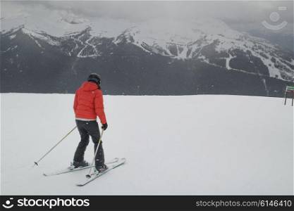 Woman skiing on snow covered landscape, Whistler, British Columbia, Canada