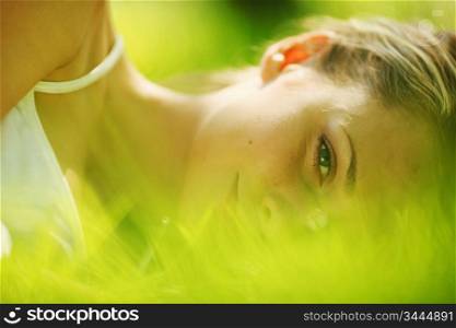 woman sleep on green grass