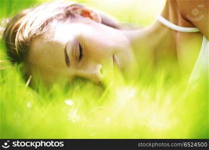 woman sleep on green grass. woman sleep on grass