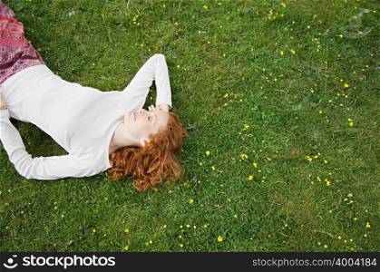 Woman sleeping in a field