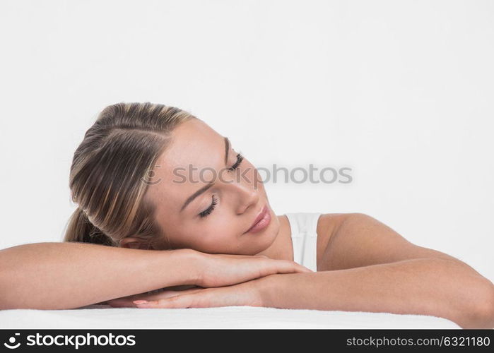 Woman sleeping in a white bed.. Beautiful young woman sleeping in a white bed.