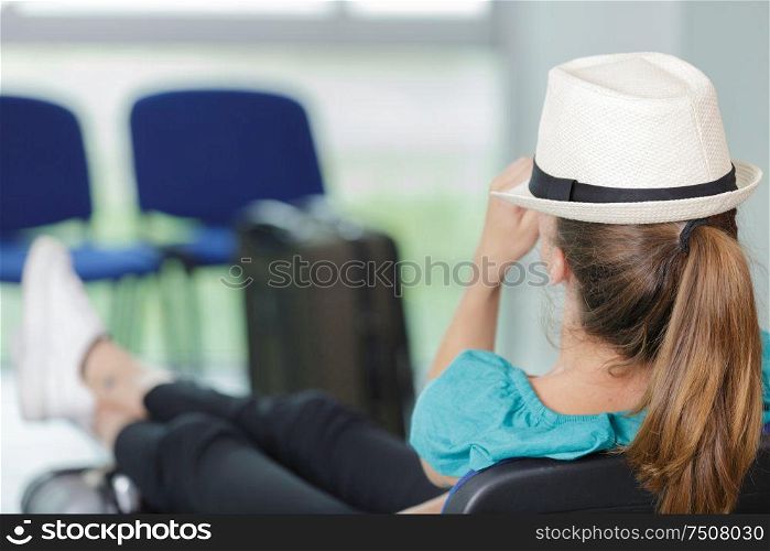 woman sleeping in airport terminal