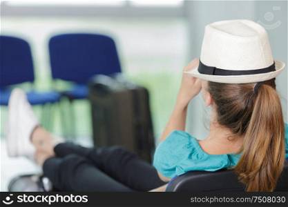 woman sleeping in airport terminal