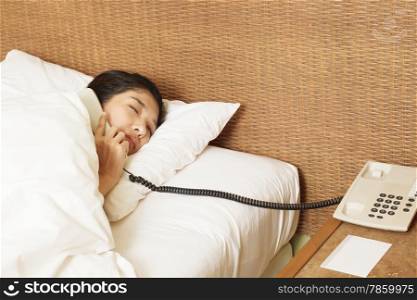woman sleeping in bed and phone