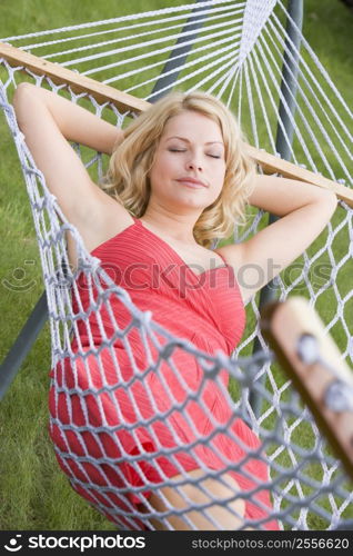 Woman sleeping in hammock