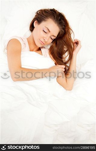 Woman sleeping in her bed