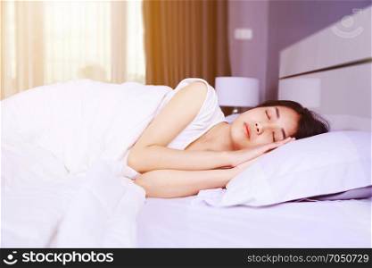 woman sleeping on bed in the bedroom