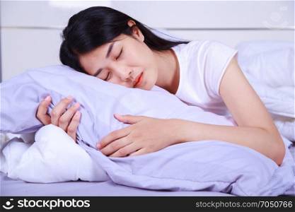 woman sleeping on bed in the bedroom