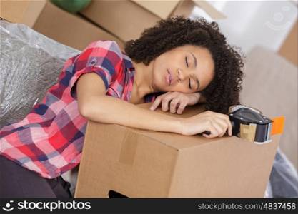 woman sleeping on carton