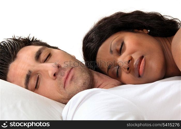 Woman sleeping on her husband