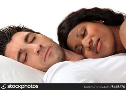 Woman sleeping on her husband