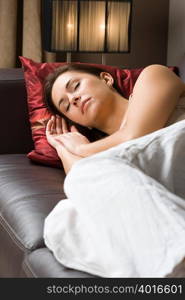 Woman sleeping on sofa