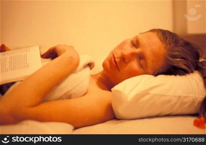 Woman Sleeping With Book on Her Chest
