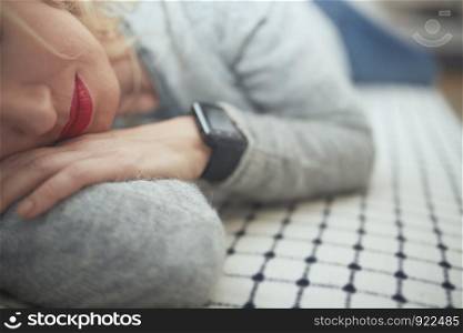 Woman sleeping with smart watch