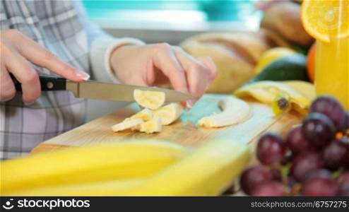 woman sliced banana in the kitchen