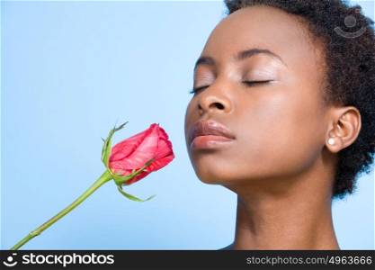 Woman smelling rose