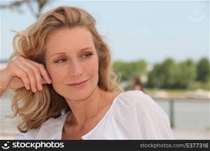 woman smiling and thinking