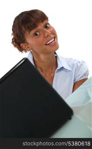 Woman smiling at a laptop