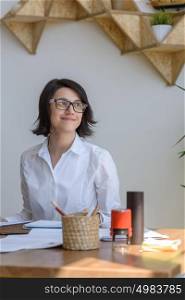 Woman smiling at office during working day