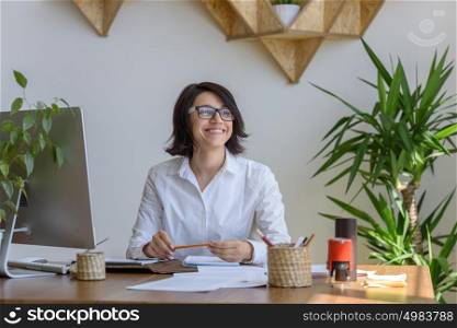 Woman smiling at office during working day